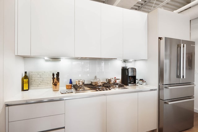 kitchen featuring white cabinetry and appliances with stainless steel finishes