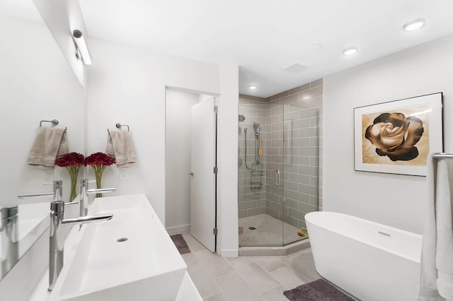 bathroom featuring tile patterned floors, vanity, and plus walk in shower