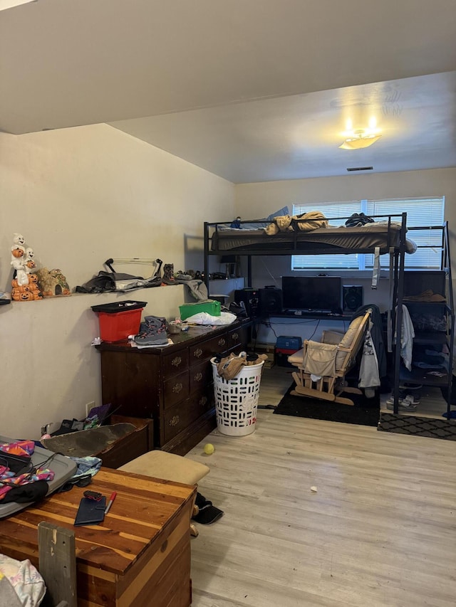 bedroom with light hardwood / wood-style flooring