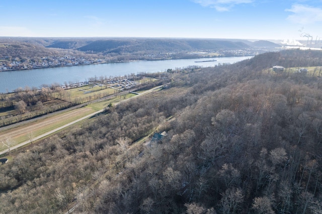 drone / aerial view featuring a water and mountain view