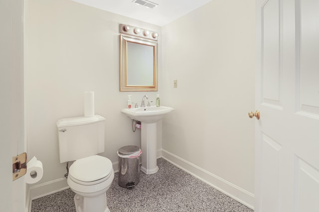 bathroom with sink and toilet