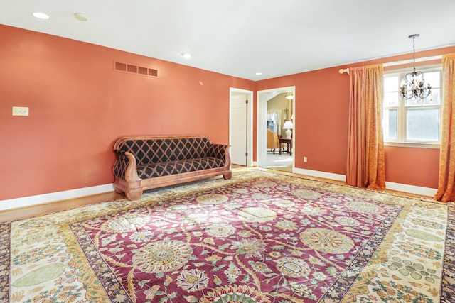 living area featuring a notable chandelier