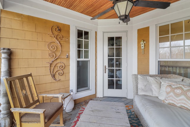 view of exterior entry with ceiling fan