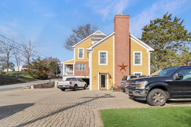 view of side of home with a garage