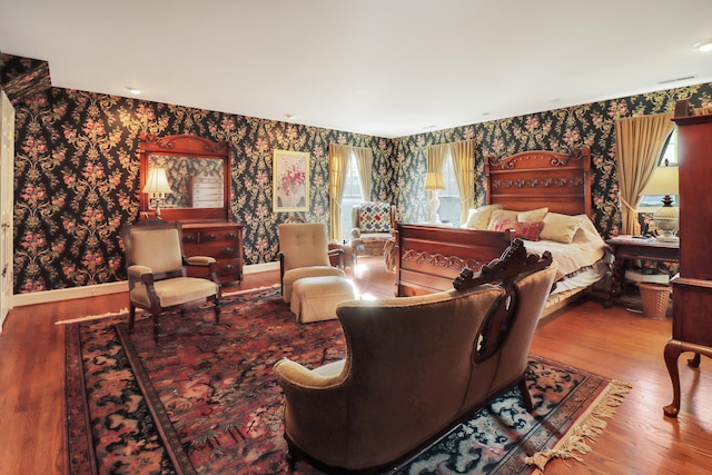 bedroom featuring multiple windows and hardwood / wood-style floors