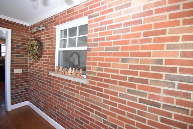 details with hardwood / wood-style floors and crown molding