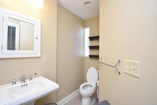 bathroom with sink and toilet