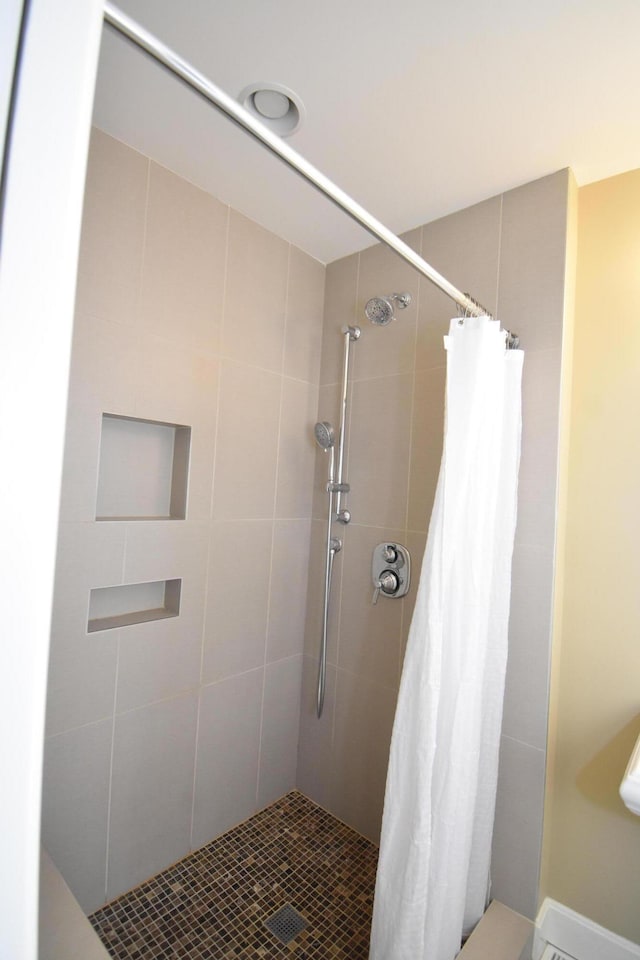 bathroom with a shower with shower curtain