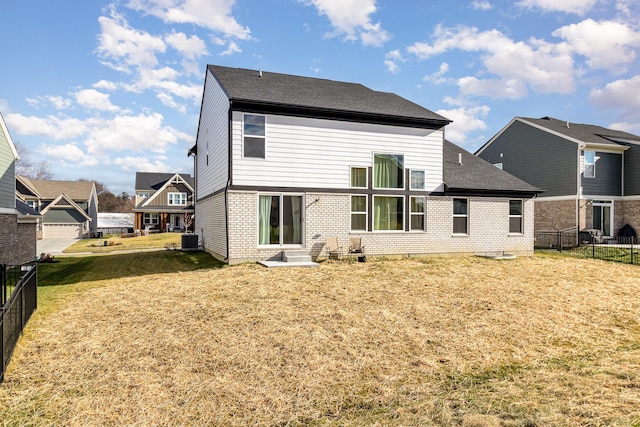 back of house with a yard and cooling unit