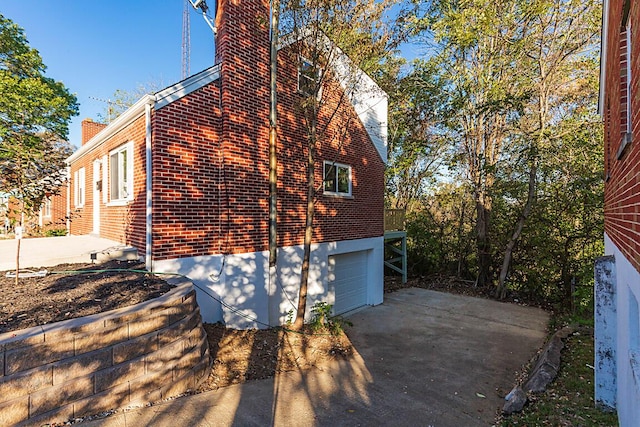 view of side of property with a garage