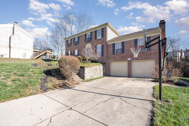 view of front of property with a garage and a front lawn