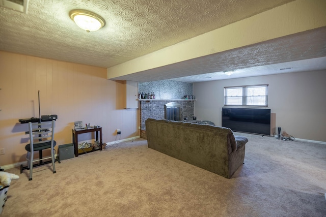 carpeted living room with a textured ceiling