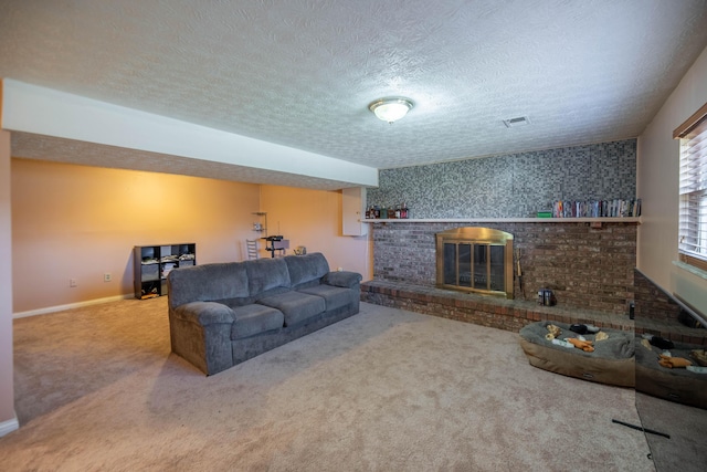 living room with carpet flooring, a fireplace, and a textured ceiling