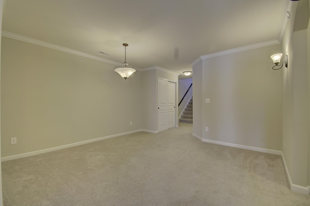 unfurnished room featuring light colored carpet and crown molding