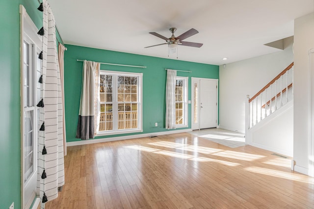 interior space with light wood-type flooring and ceiling fan