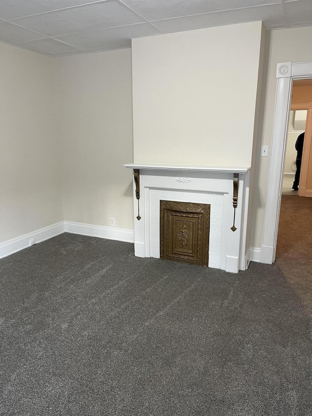 unfurnished living room with dark carpet