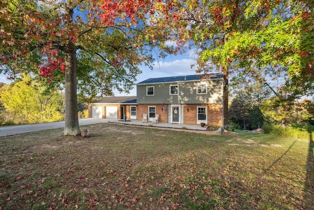 view of front of home featuring a garage and a front lawn