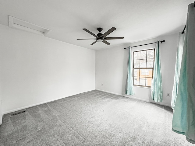 empty room with carpet flooring and ceiling fan