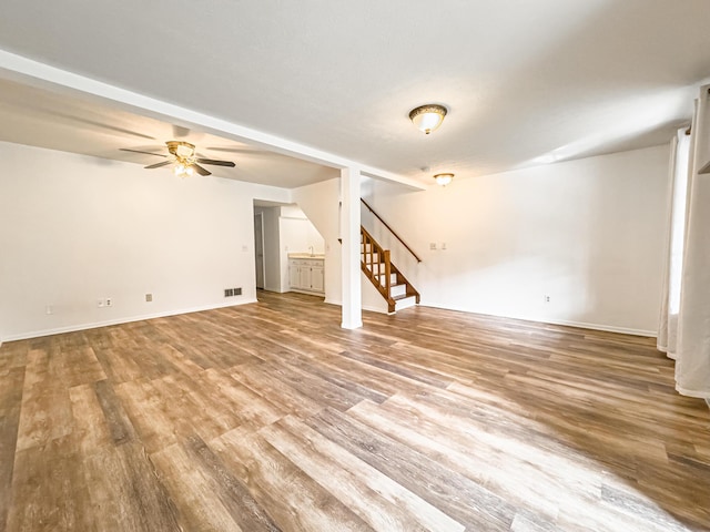 unfurnished living room featuring hardwood / wood-style floors