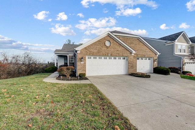 view of front of property featuring a garage and a front lawn