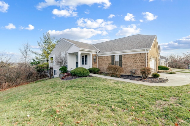 view of front of property featuring a front yard and a garage