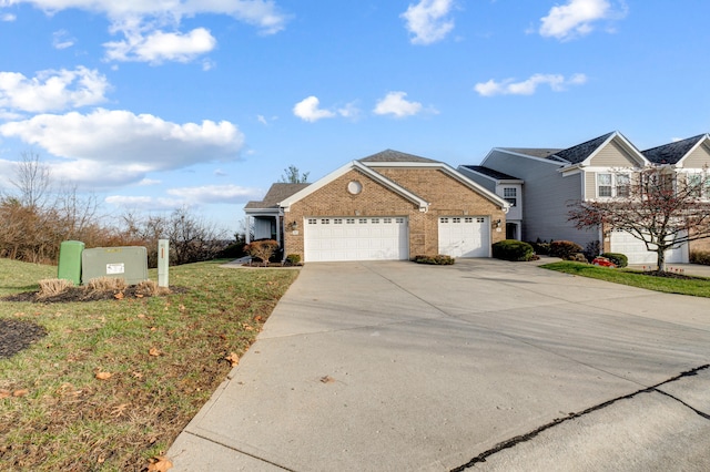 view of front of property with a front lawn and a garage