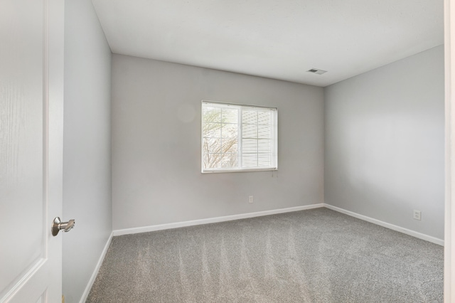 empty room featuring carpet flooring