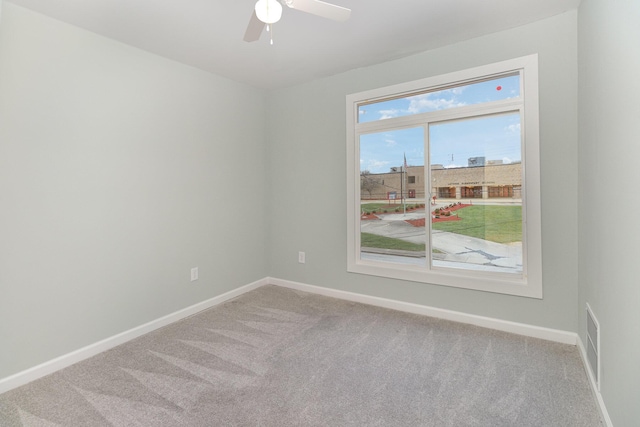 carpeted empty room with ceiling fan