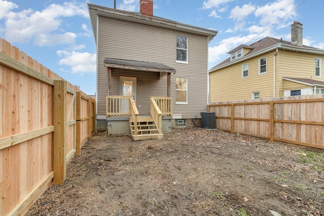 back of house with central AC