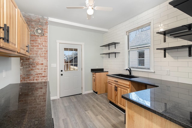 kitchen with ceiling fan, light hardwood / wood-style flooring, a wealth of natural light, and sink