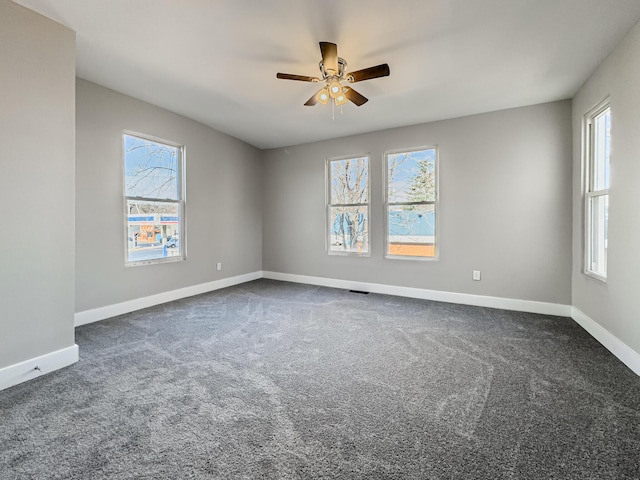 carpeted empty room with ceiling fan