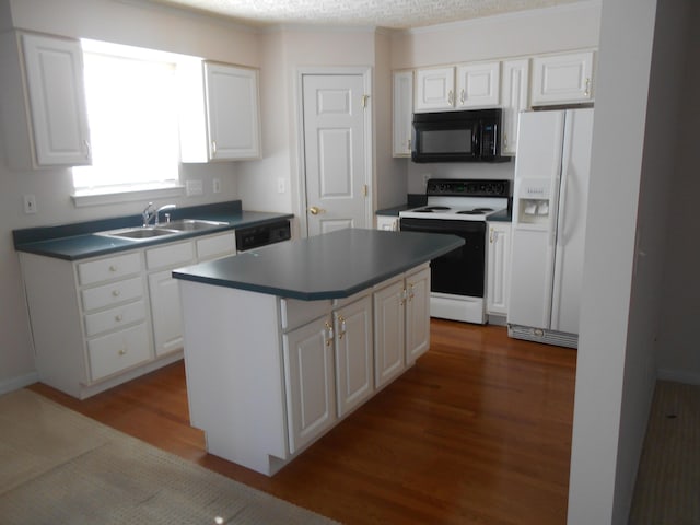 kitchen with white cabinetry and black appliances