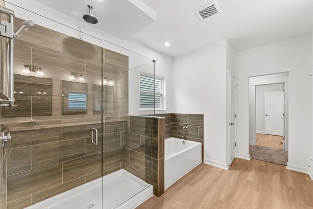 2516 Winners Post Way, Burlington, KY 41005 - full bath with a stall shower, wood finished floors, a garden tub, and baseboards