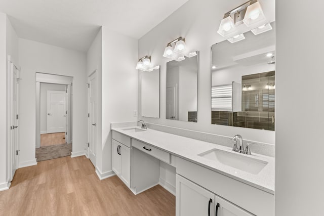 2516 Winners Post Way, Burlington, KY 41005 - bathroom with wood finished floors, double vanity, a stall shower, and baseboards