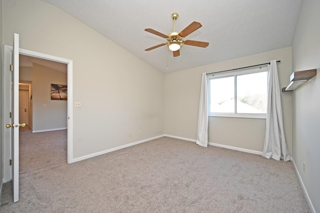 unfurnished room featuring light carpet, ceiling fan, and lofted ceiling