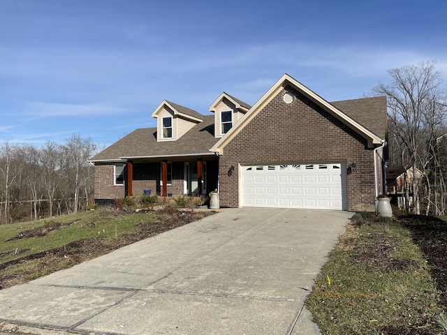 view of front of home with covered porch and a garage