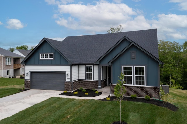 3850 Sherbourne Dr, Independence, KY 41051 - view of front of home with board and batten siding, brick siding, concrete driveway, and roof with shingles