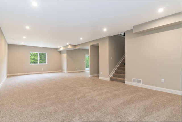 3850 Sherbourne Dr, Independence, KY 41051 - below grade area with light colored carpet, recessed lighting, stairs, and baseboards