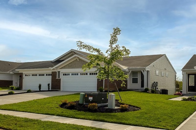 view of front facade with an attached garage, a front lawn, and driveway
