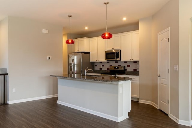 kitchen featuring white cabinets, stainless steel appliances, dark wood-style floors, and tasteful backsplash