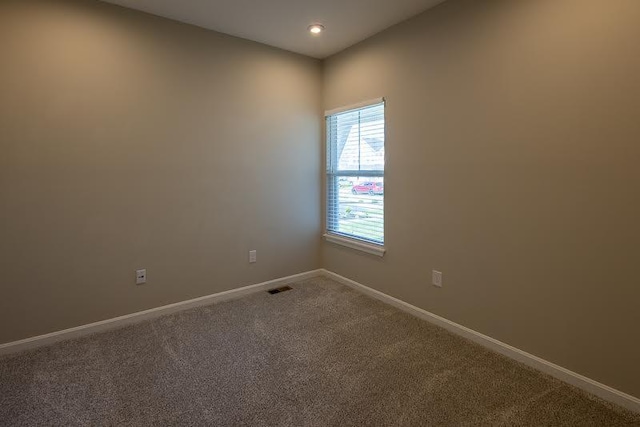 unfurnished room with carpet floors, recessed lighting, baseboards, and visible vents