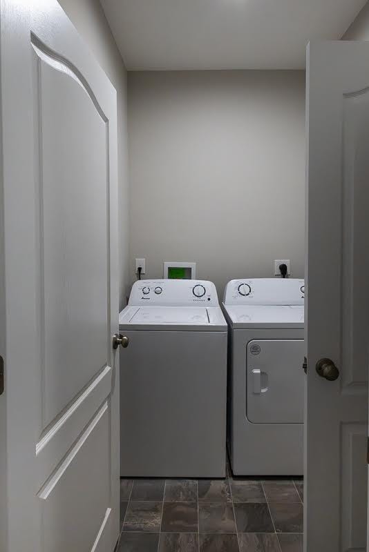 washroom featuring laundry area and independent washer and dryer