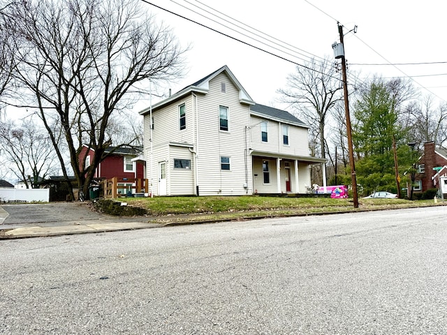 view of front property featuring covered porch