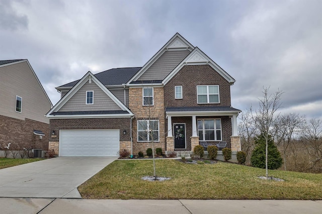 craftsman-style home featuring a front yard, central air condition unit, and a garage