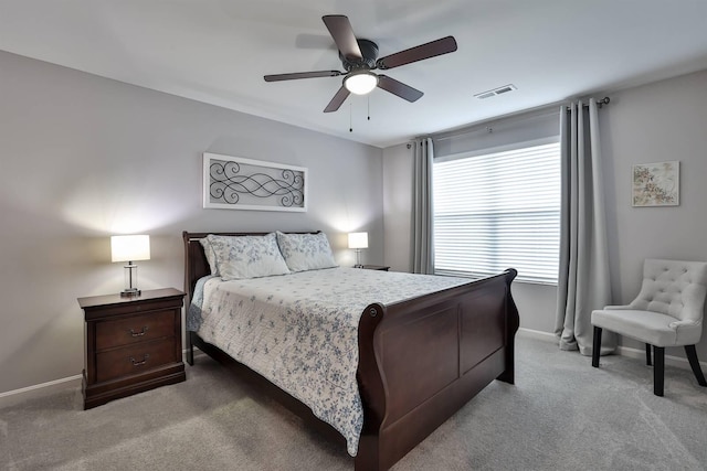 bedroom featuring ceiling fan and carpet