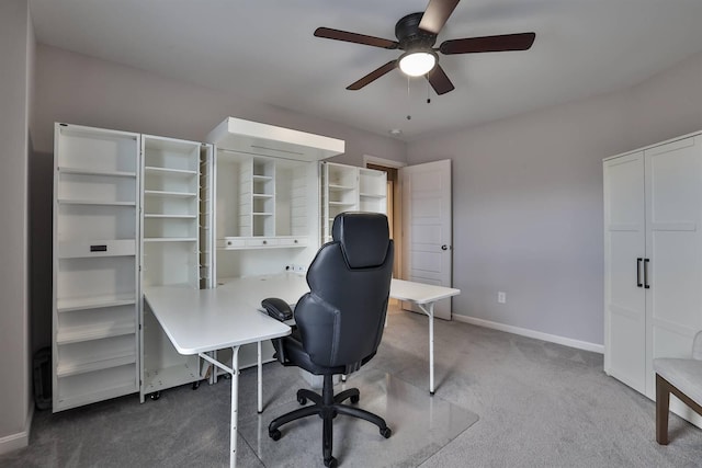 carpeted office featuring ceiling fan