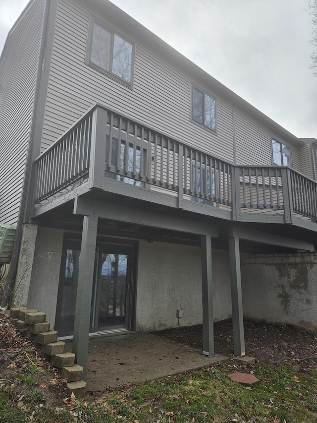 back of house featuring a balcony