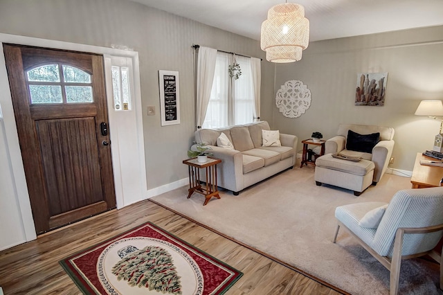 living room with wood-type flooring and a healthy amount of sunlight