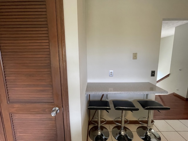 interior space featuring light tile patterned flooring