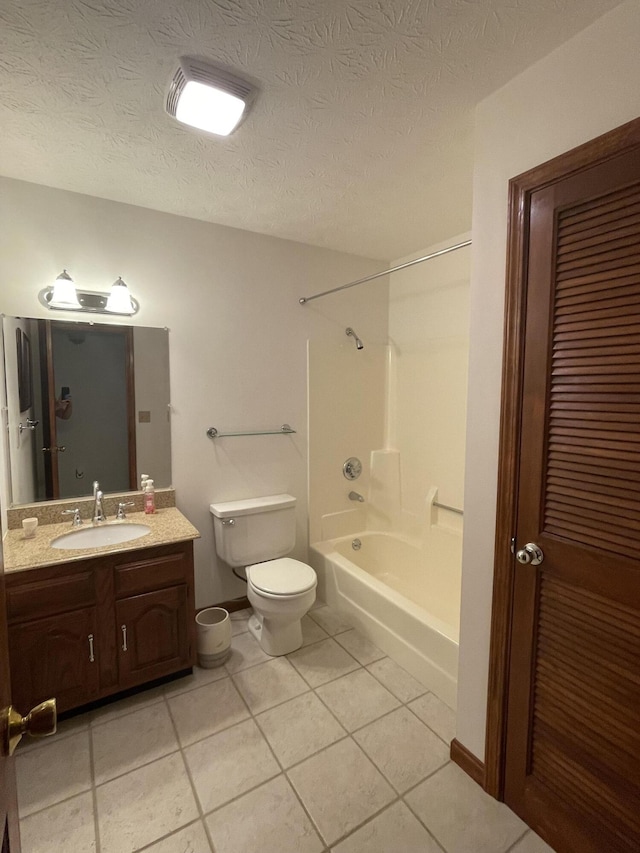 full bathroom featuring bathtub / shower combination, a textured ceiling, vanity, tile patterned flooring, and toilet